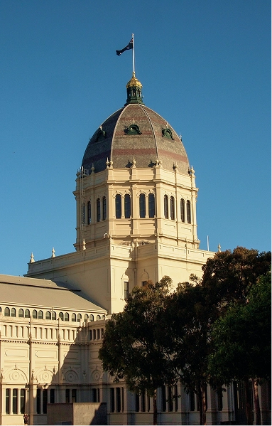 RE4ORM synthetic turf recycling &ndash; A large domed building with cream-coloured walls and arched windows stands under a clear blue sky, featuring a flag at the top and trees in the foreground&mdash;a landmark often associated with initiatives like the RE4ORM Process.